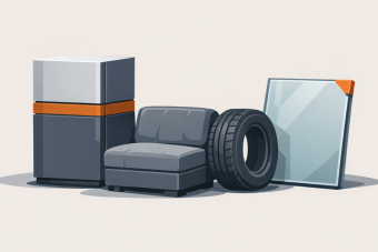 A flat vector illustration shows a small group of oversized items, including a large appliance, a piece of furniture, a tire, and a pane of glass. The objects sit low and slightly left on a light stone-colored background with soft shadows, rendered in muted neutrals with a small burnt orange accent to indicate items that are too large for standard waste containers.